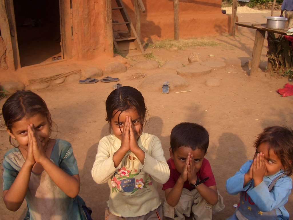 praying nepal children